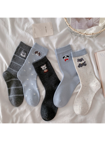 Five animal motif crew sock styles displayed together