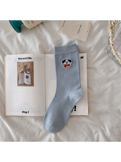 Light blue crew sock with embroidered dog and red bow tie
