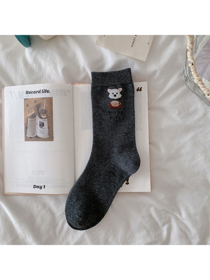 Dark gray crew sock with white dog and coffee cup motif