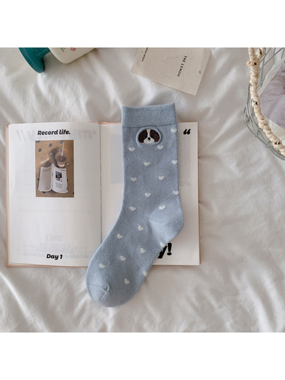 Light blue crew sock with embroidered dog and white heart pattern