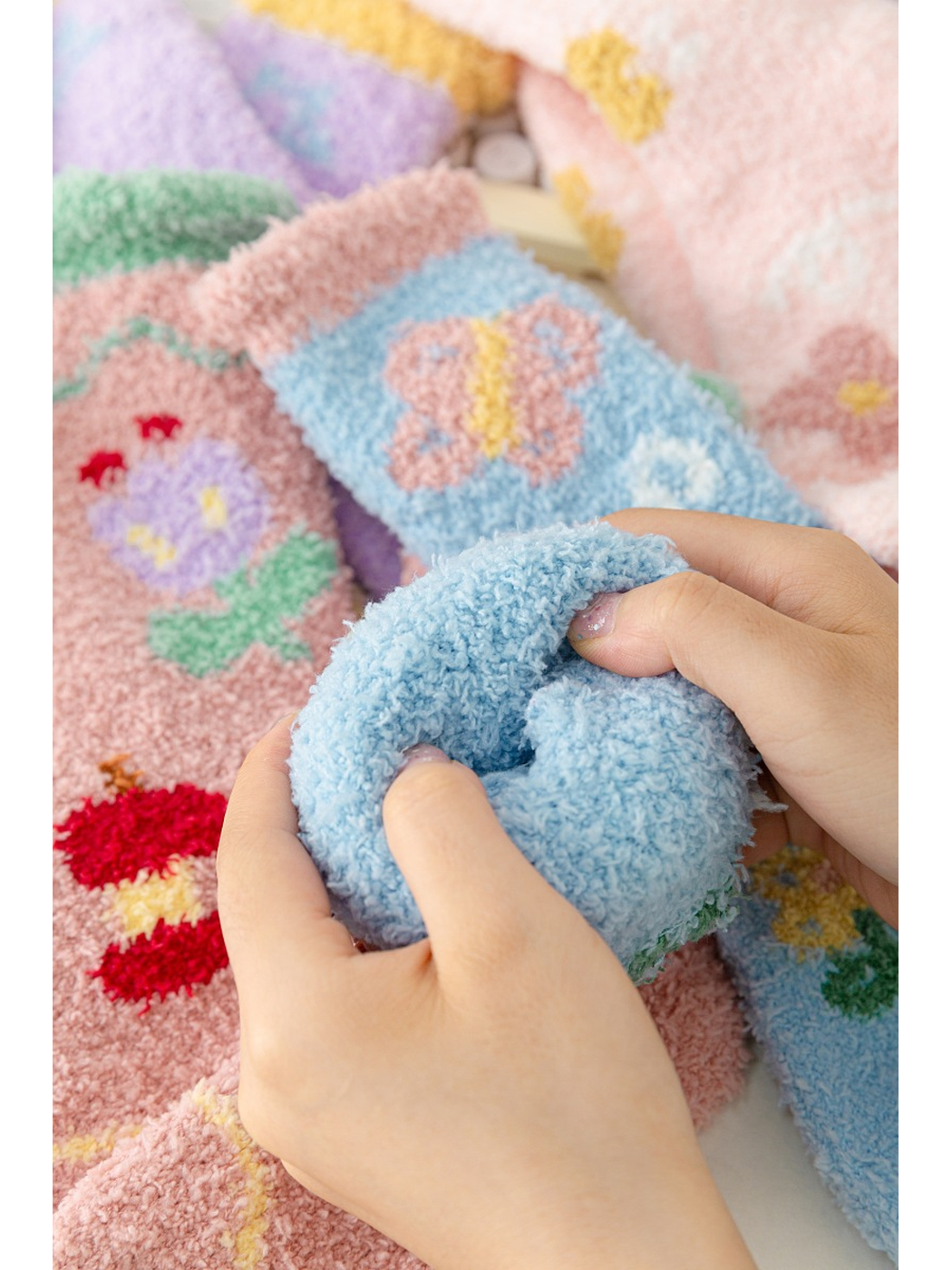 Close-up of the dense fuzzy texture inside a folded blue sock cuff