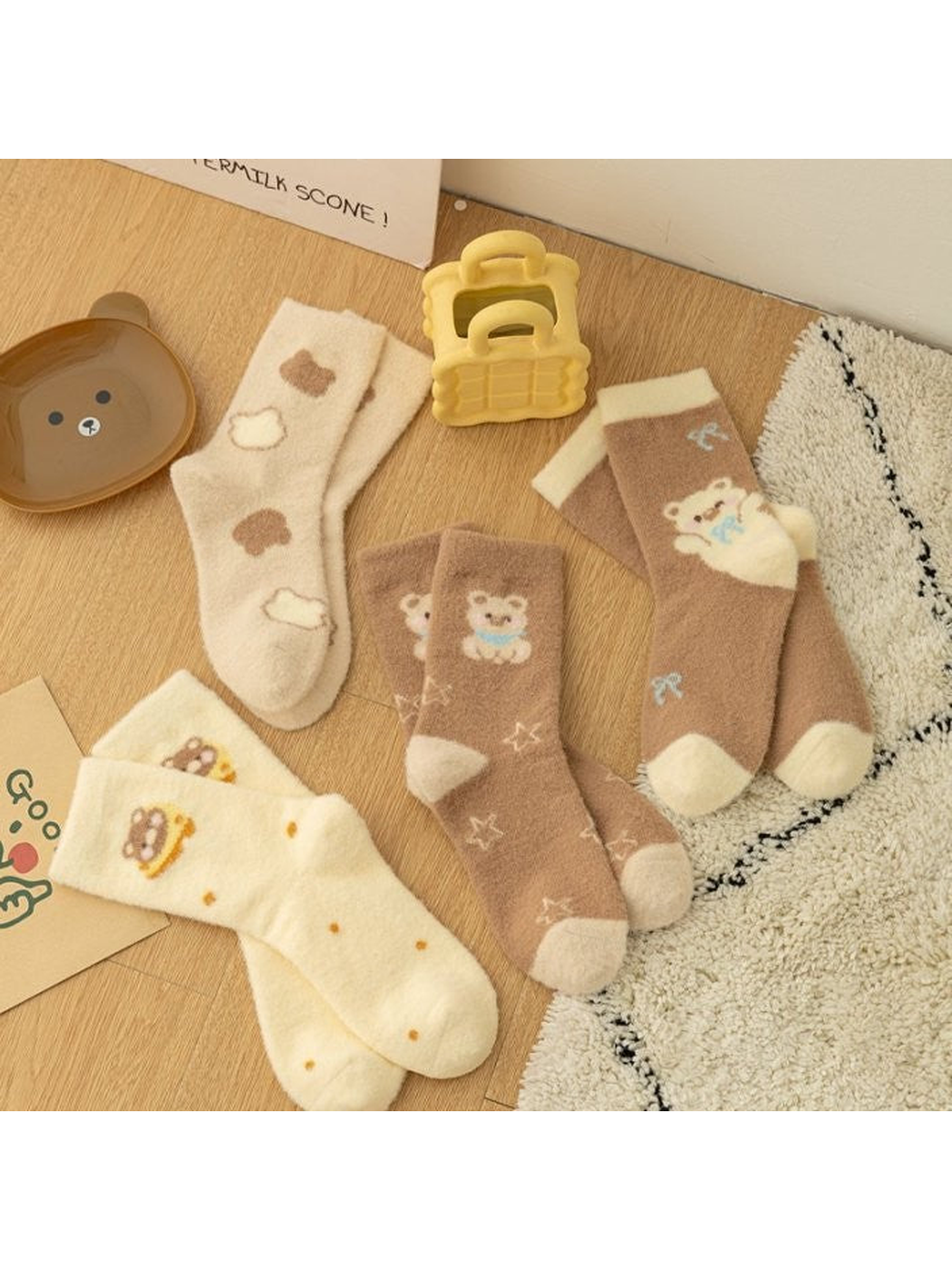 Four cream and khaki patterned crew sock styles displayed together