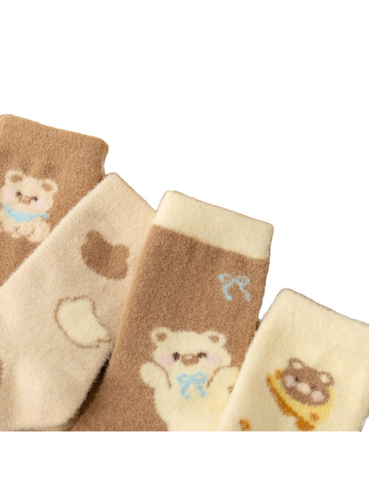 Close-up of the fuzzy texture and motifs across four crew sock styles