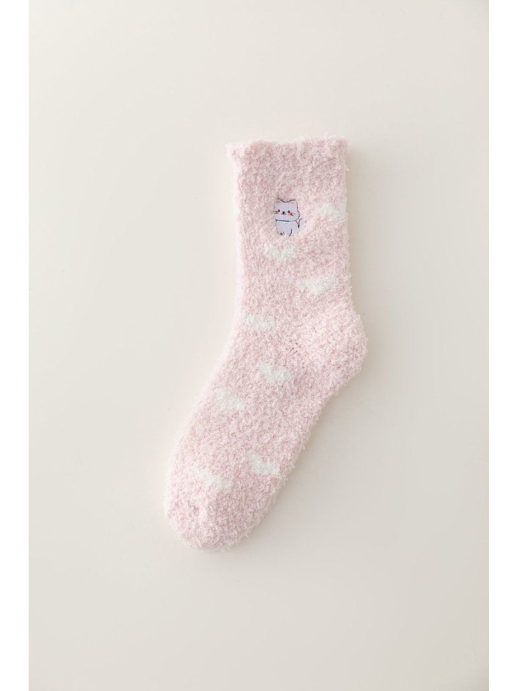 Light pink fuzzy crew sock with white cloud accents and an embroidered cat, full view
