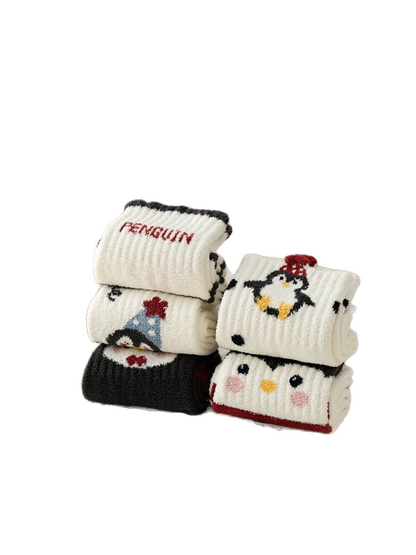 Five folded penguin crew sock designs grouped on a white background
