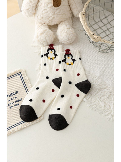 Ivory crew socks with penguin graphics and black and red dots