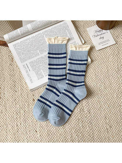 Light blue ribbed crew socks with navy and ivory stripes