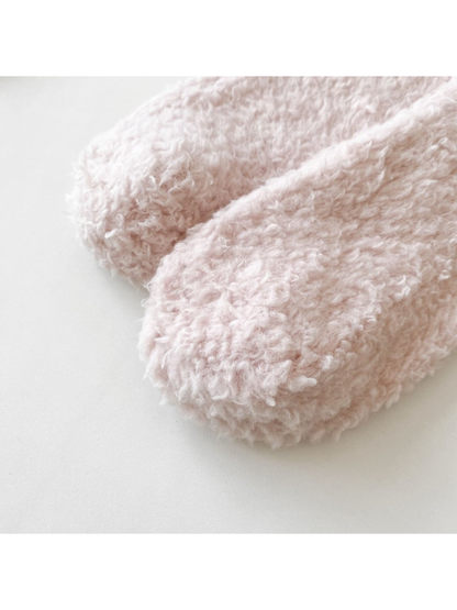Close-up of the rounded toe and fuzzy surface in light pink