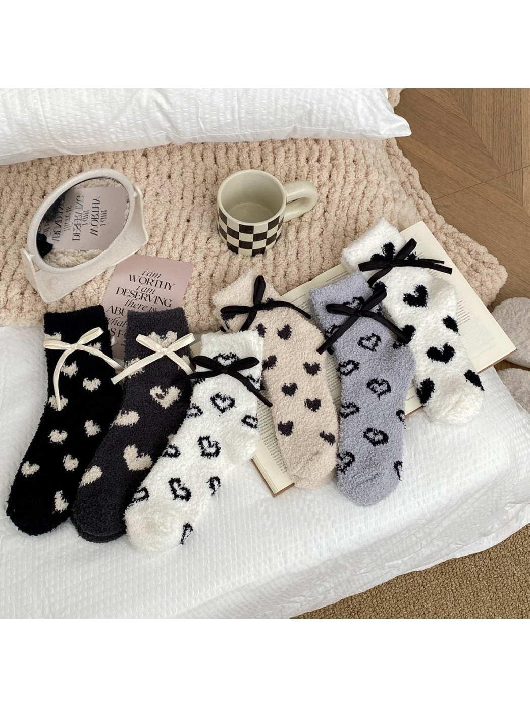 Assorted fuzzy heart-pattern socks displayed together