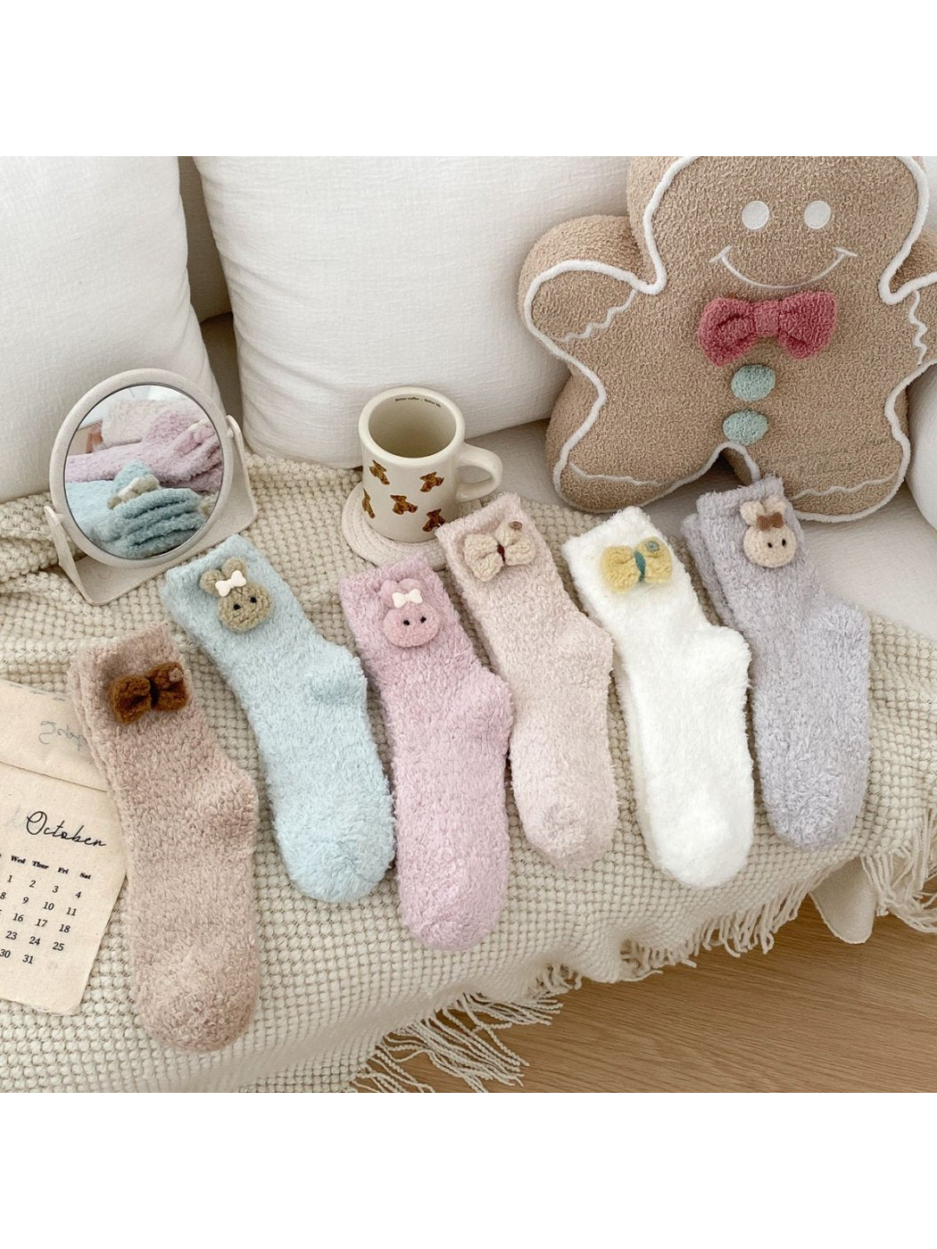 Six fuzzy crew sock styles with decorative cuff appliques