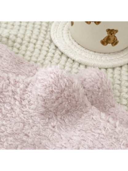 Close-up of the light pink fuzzy surface texture
