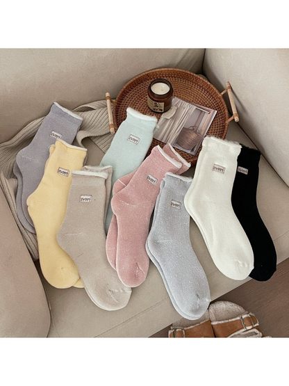Assorted ribbed crew socks in eight colors displayed together