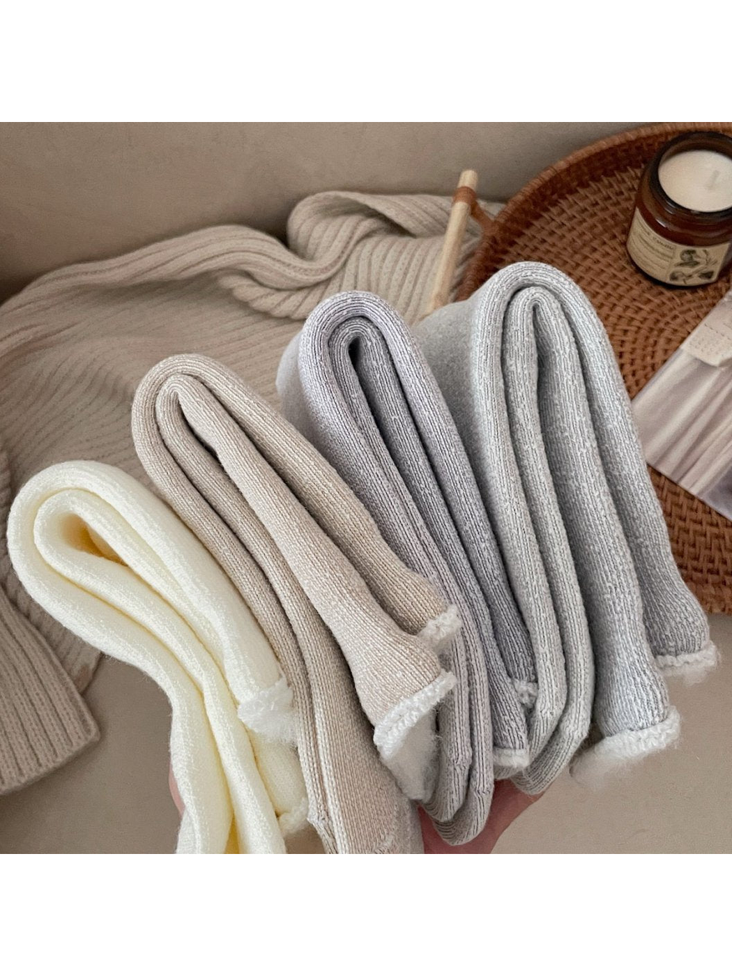 Close-up of folded ribbed socks with fuzzy rolled cuff edges
