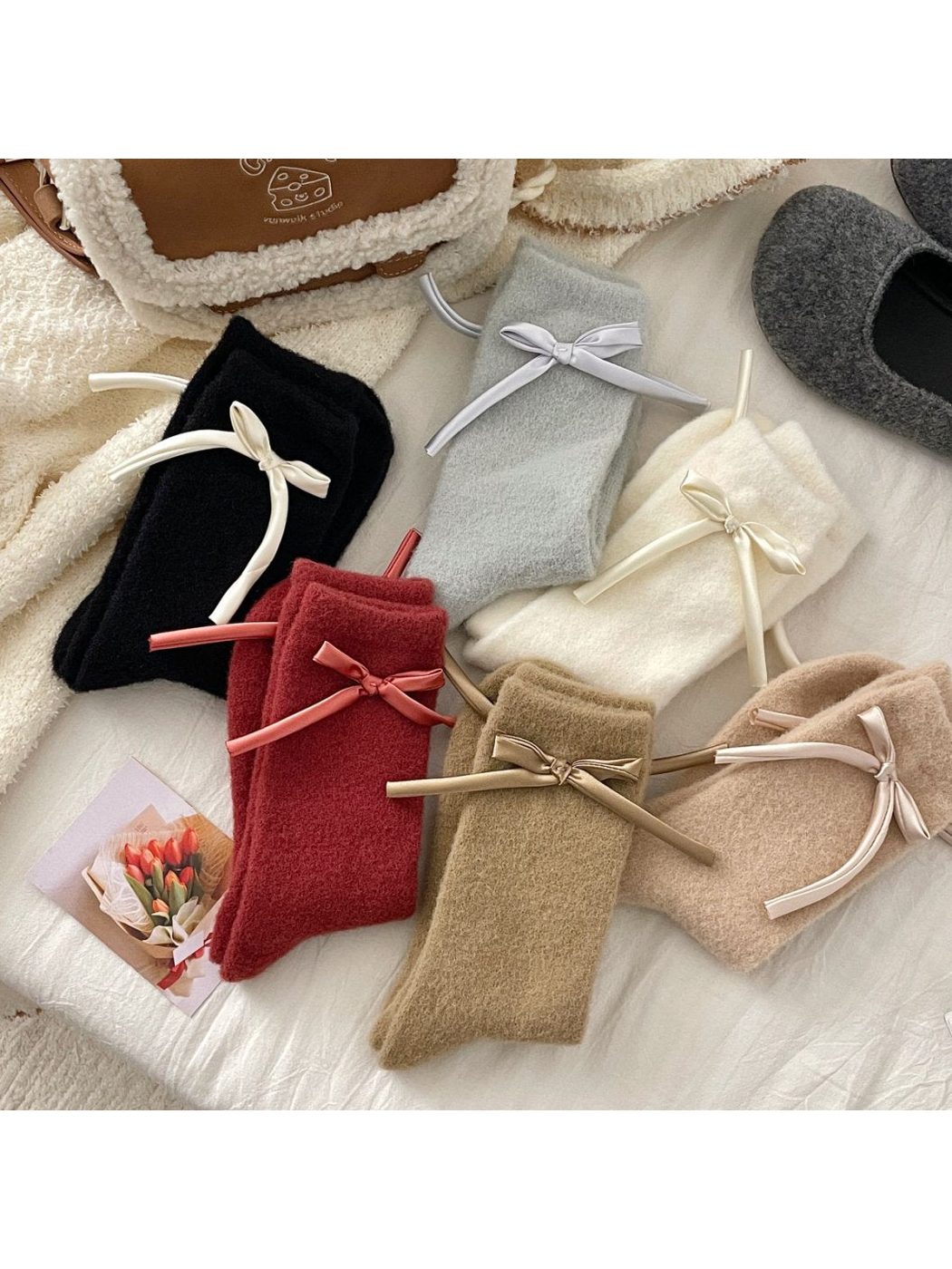 Fuzzy crew socks in six colors with ribbon bows arranged together