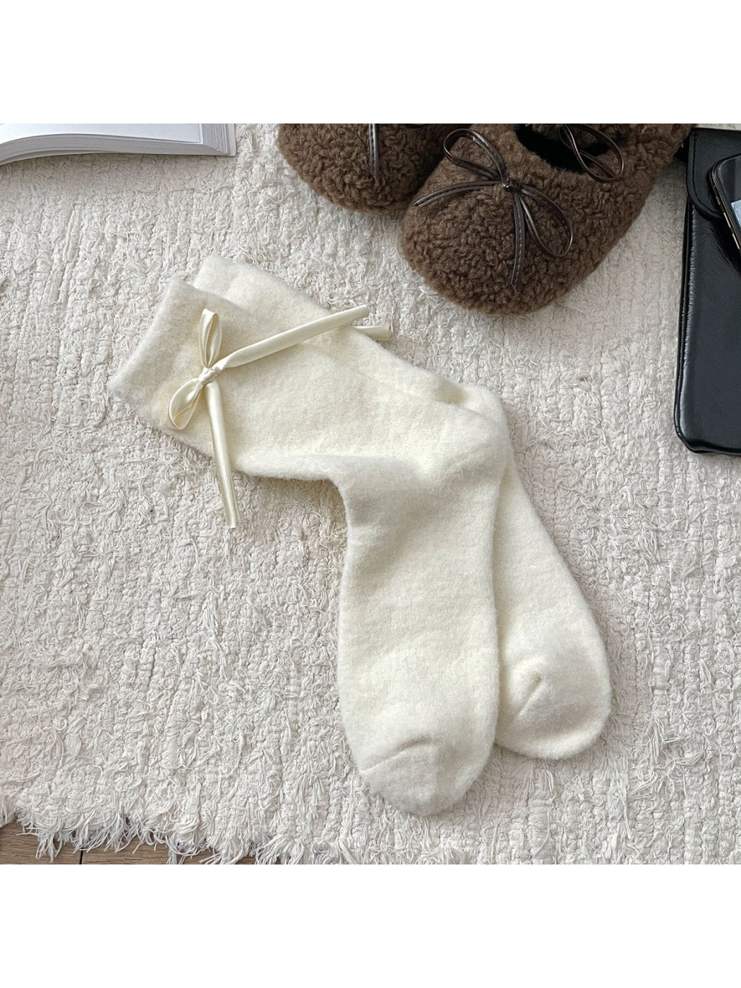 Ivory fuzzy crew socks with a ribbon bow