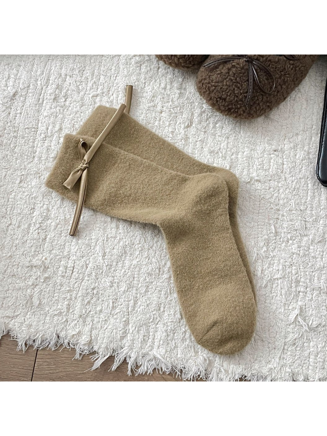 Khaki fuzzy crew socks with a matching ribbon bow