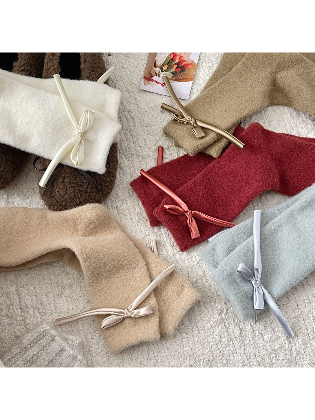 Five ribbon-bow sock colors arranged in a flat lay
