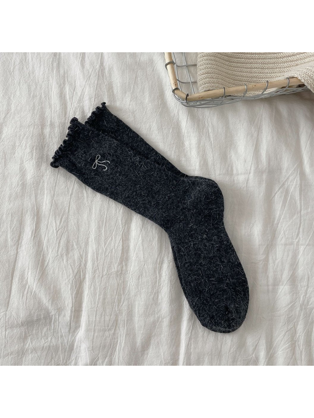Dark gray ribbed crew socks with bow motif and ruffled cuffs