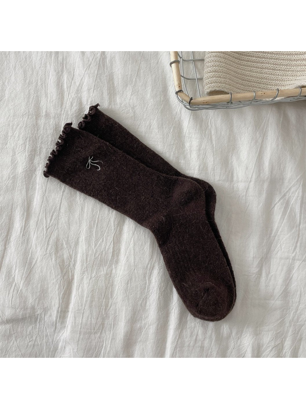 Dark brown ribbed crew socks with bow motif and ruffled cuffs