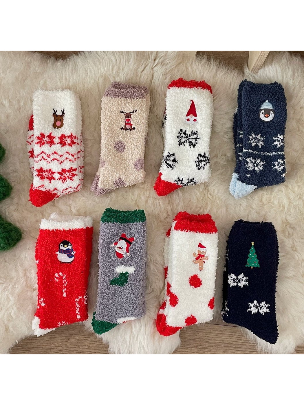 Eight fuzzy holiday sock designs arranged together