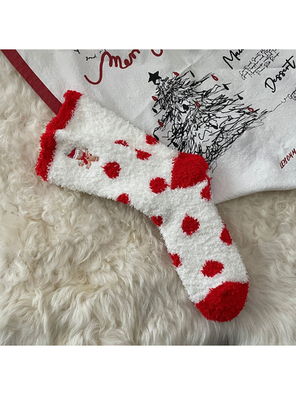 White fuzzy socks with red dots and embroidered gingerbread figure