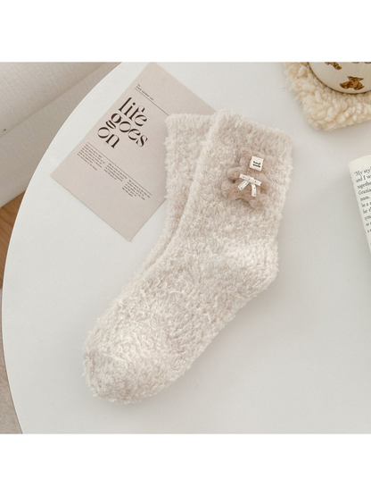 Beige fuzzy sock with matching teddy bear applique