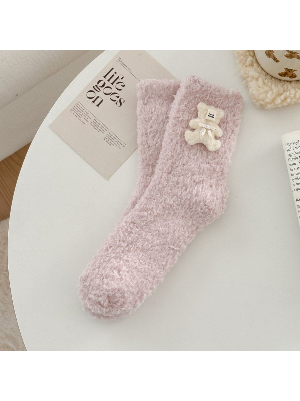 Light pink fuzzy sock with ivory teddy bear applique