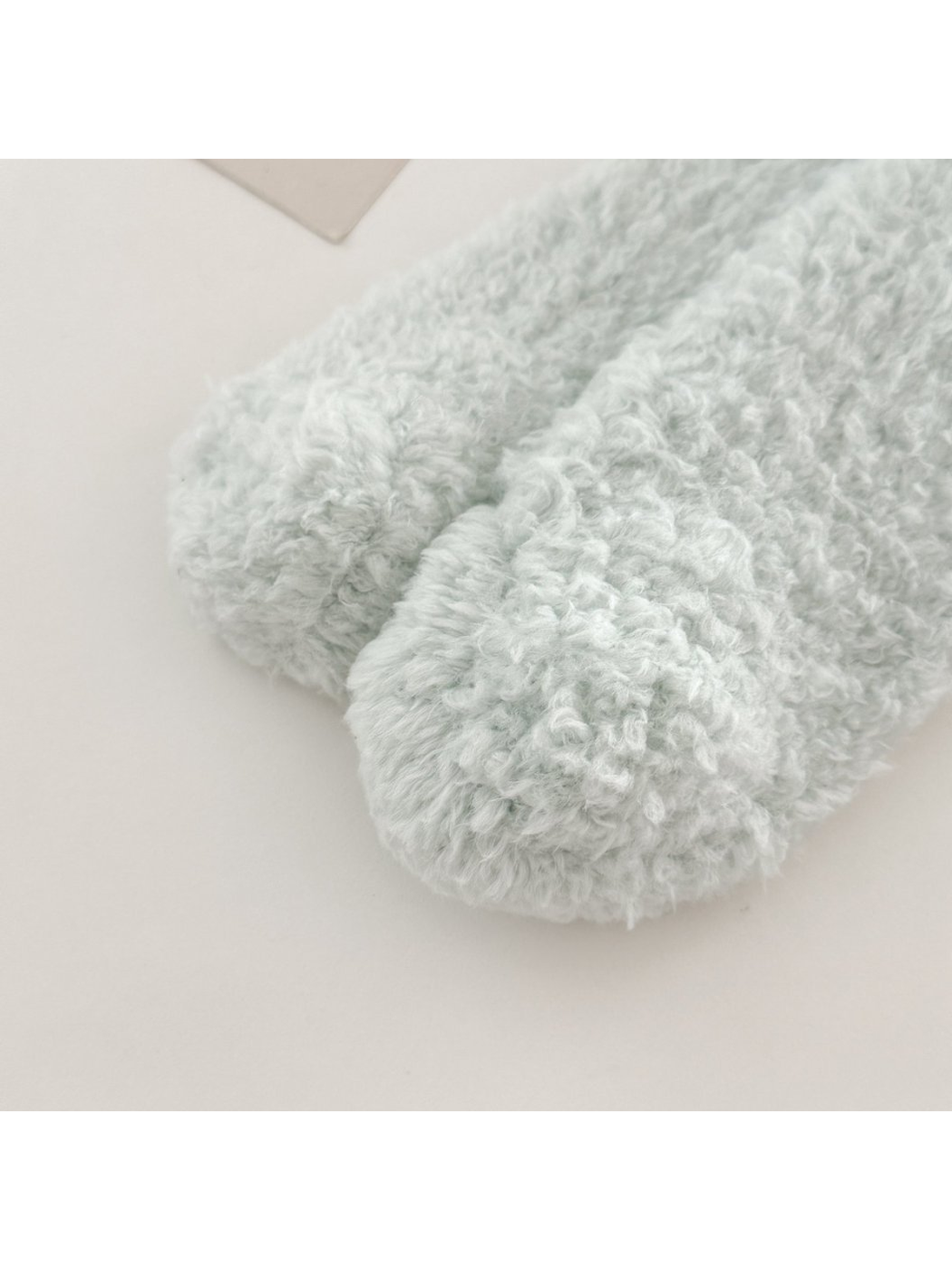 Close-up of the fuzzy toe shape and visible toe seam