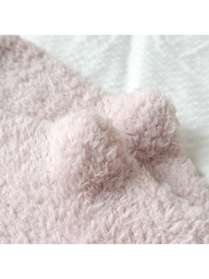 Close-up of the dusty pink sock cuff opening and fuzzy texture