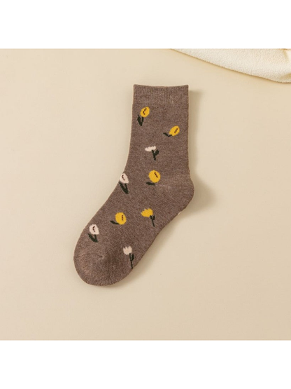 Brown crew sock with scattered yellow and white flowers