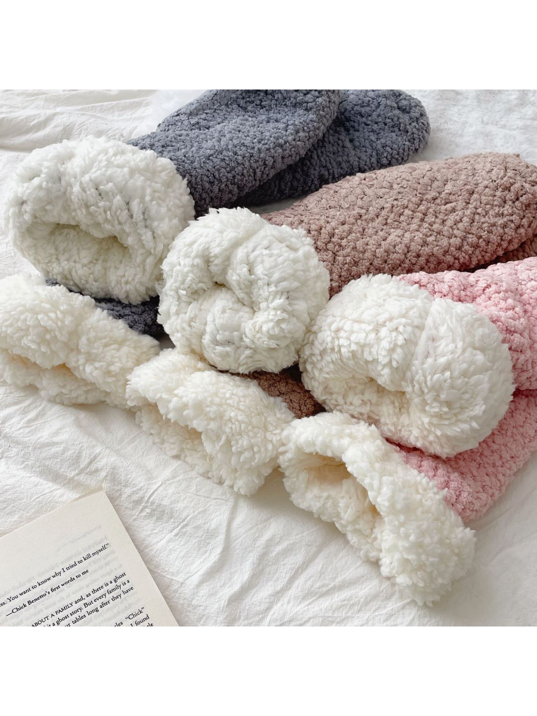 Close-up of the contrasting ivory folded cuffs on all three sock colors