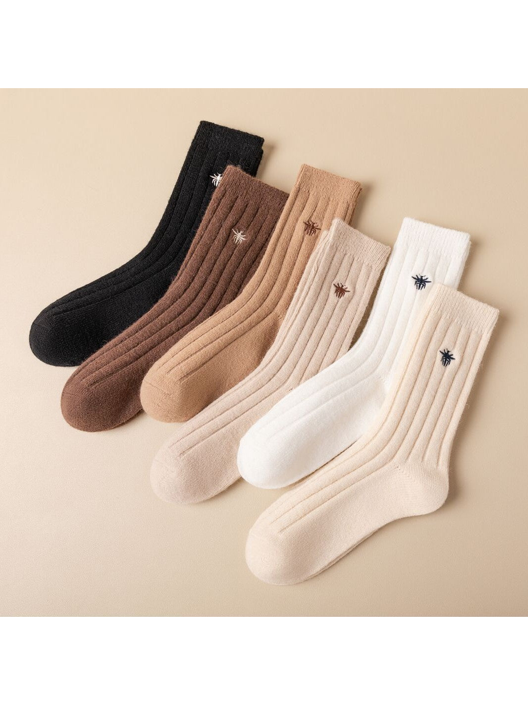 Six neutral-color ribbed crew socks with embroidered insect motifs