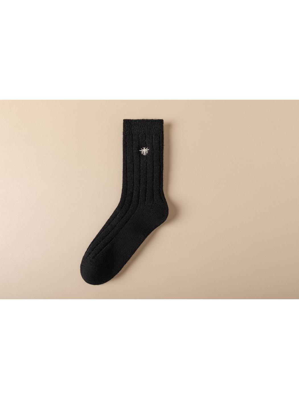 Black ribbed crew sock with white embroidered insect motif