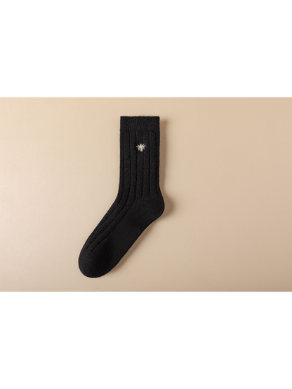Black ribbed crew sock with white embroidered insect motif