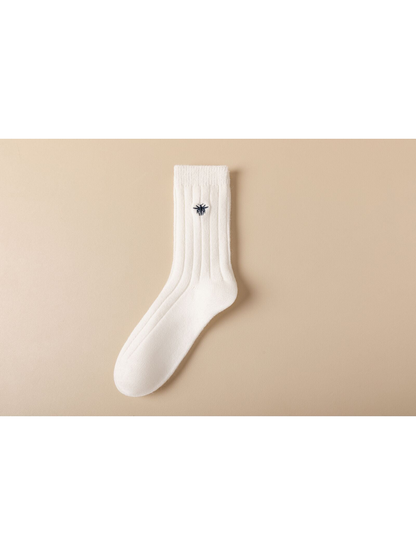 White ribbed crew sock with dark embroidered insect motif