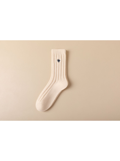 Ivory ribbed crew sock with dark embroidered insect motif