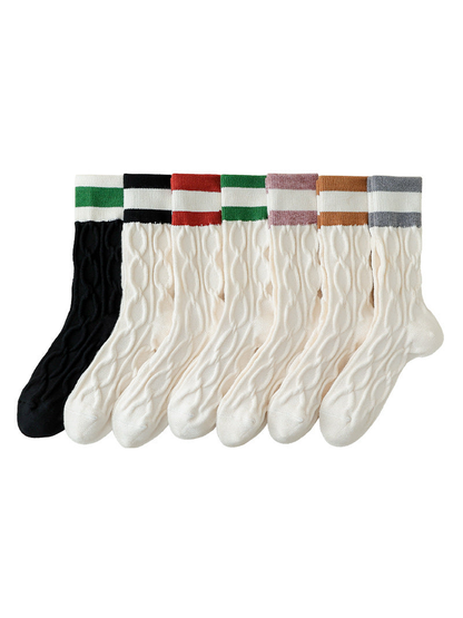 Seven cable-knit crew sock color styles displayed together
