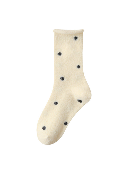 Pale yellow fuzzy polka-dot crew sock with rolled cuff