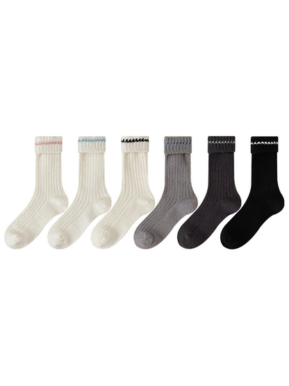 Six ribbed crew sock styles with folded contrasting cuffs