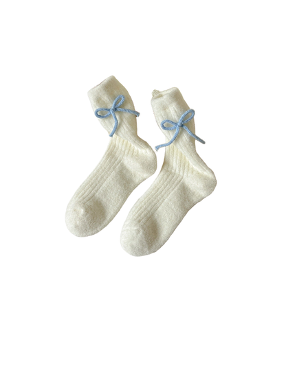 Ivory ribbed bow-accent crew socks displayed as a pair