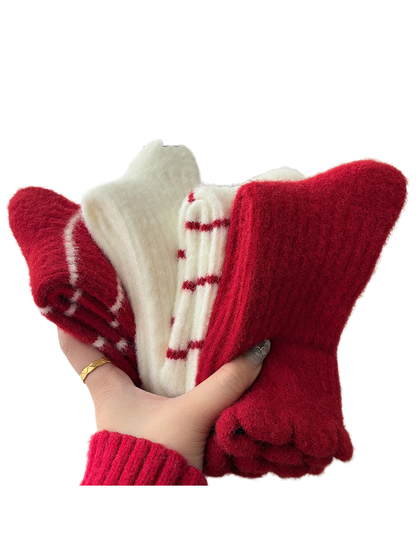 Red and ivory crew sock styles held together