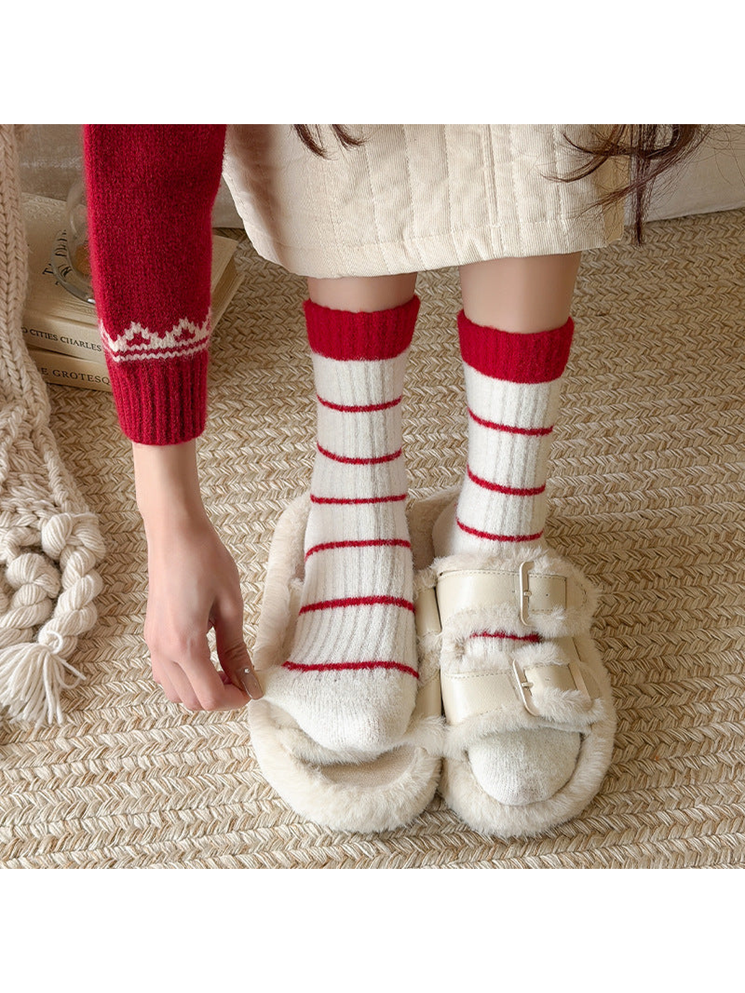 Ivory crew socks with red stripes worn with plush slippers