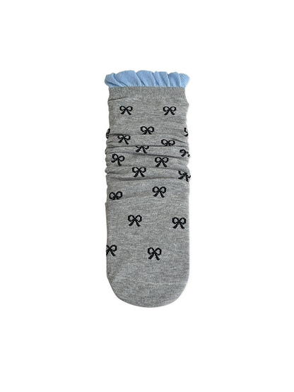 Light gray bow-pattern crew sock with a blue ruffled cuff