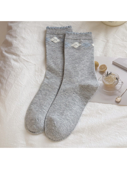 Light gray crew socks with blue and ivory argyle bands