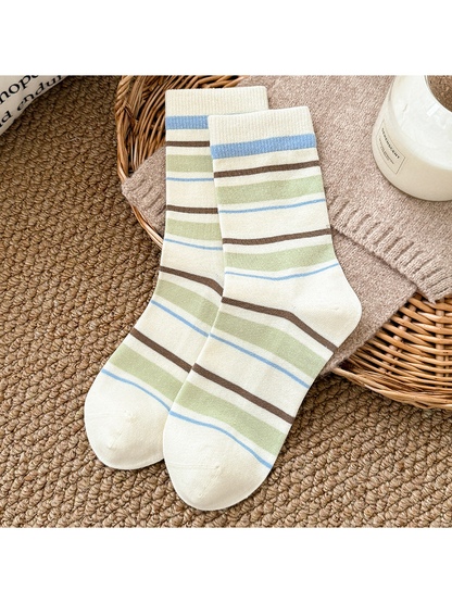 Ivory crew socks with pale green, blue and brown stripes