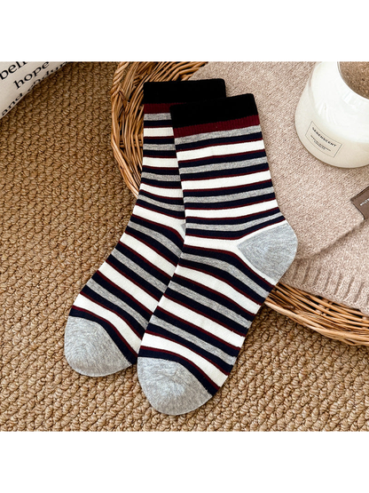 Black crew socks with burgundy, ivory and gray stripes