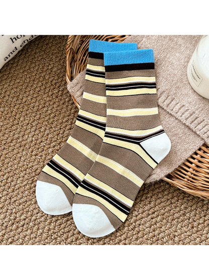 Blue and brown striped crew socks with bright blue cuffs