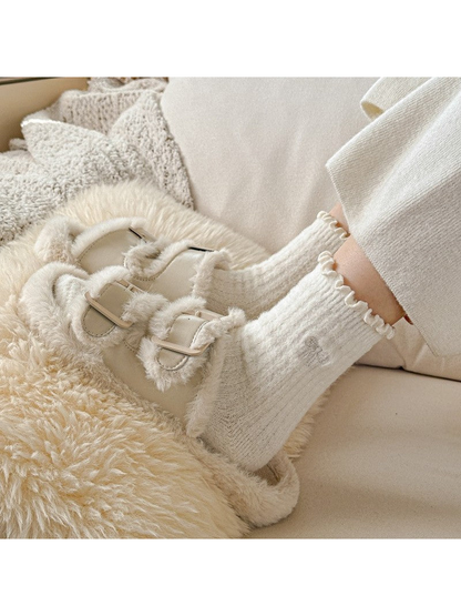 Ivory socks worn with plush buckle slippers
