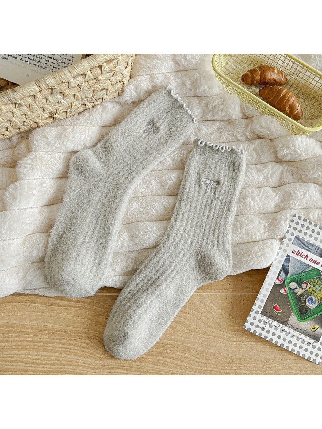 Light gray fuzzy ribbed socks with ruffled cuffs and bow motifs