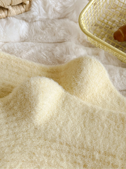 Close-up of the pale yellow socks' fuzzy surface texture